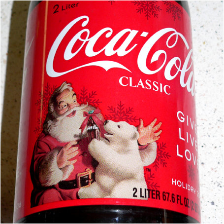 Did Santa give the bear the Cola bottle or is the bear giving it to him? The world may never know for sure!