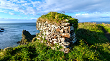 Re's special stone wall spot on the North Antrim Cliff Path overlooking the Atlantic Ocean.