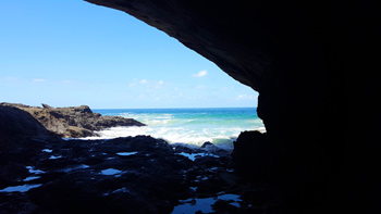 In the middle of the cave, there's an opening leading out to the Pacific Ocean.